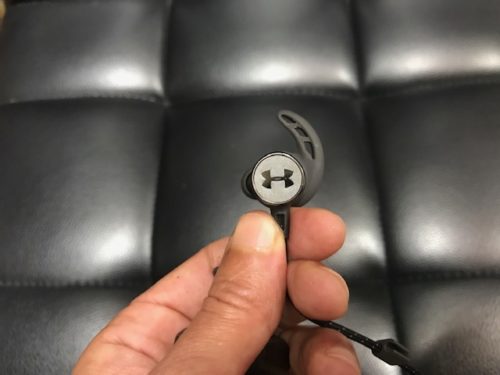 Under Armour Sport Wireless React by JBL logo image on earbud