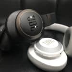 JBL Live 650BTNC vs JBL E65BTNC Review JBL Live 650BTNC in black stacked over JBL E65BTNC