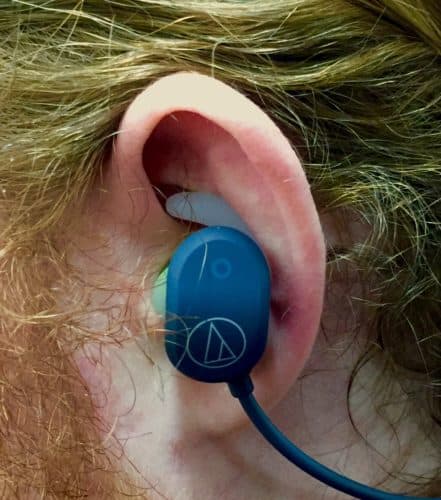 The ATH-SPORT60BT sitting in this reviewer's ear