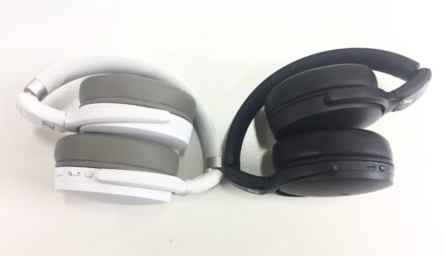 Sennheiser HD350BT and HD450BT sitting next to each other, folded up